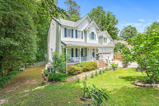 4705 Royal Troon Dr, Raleigh, NC 27604 - victorian-style house with covered porch, driveway, and roof with shingles
