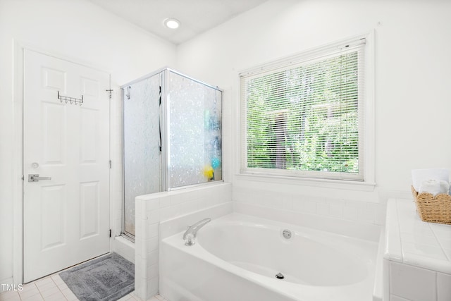 4705 Royal Troon Dr, Raleigh, NC 27604 - bathroom with a garden tub, a stall shower, and tile patterned floors