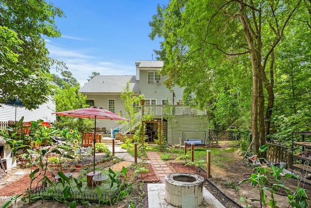 4705 Royal Troon Dr, Raleigh, NC 27604 - rear view of property featuring a fire pit, stairs, a deck, and a shingled roof