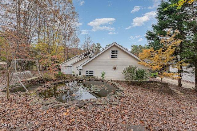 103 Pony Express Cv, Louisburg, NC 27549 - view of side of property with a small pond