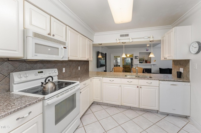 103 Pony Express Cv, Louisburg, NC 27549 - kitchen featuring white appliances, a sink, white cabinets, light tile patterned flooring, and hanging light fixtures