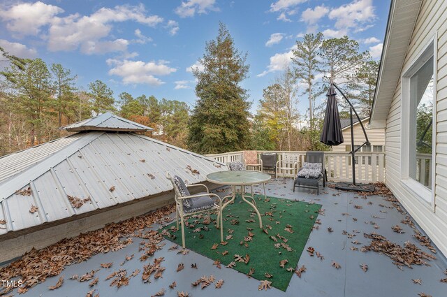 103 Pony Express Cv, Louisburg, NC 27549 - view of patio with a deck and view of wooded area