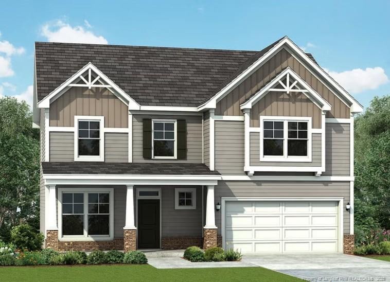 690 Southerland Peak Dr, Raeford, NC 28376 - view of front of property with board and batten siding, an attached garage, concrete driveway, and brick siding