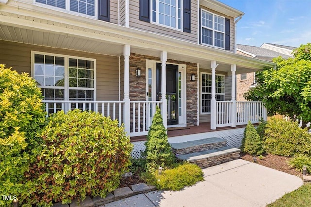 947 Middle Ground Ave, Rolesville, NC 27571 - view of exterior entry with a porch and stone siding