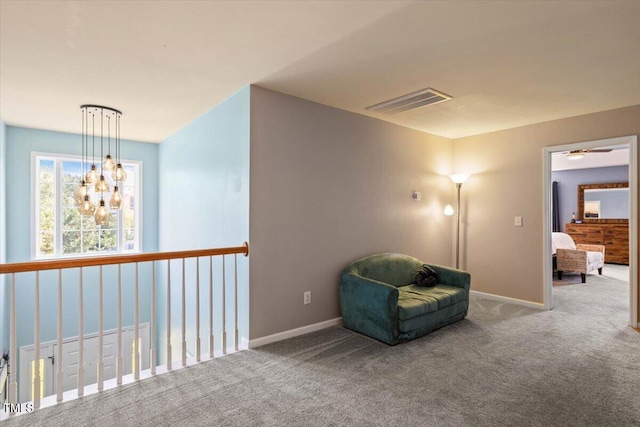 947 Middle Ground Ave, Rolesville, NC 27571 - living area with carpet flooring, baseboards, and a chandelier