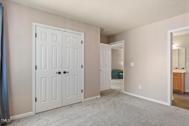 947 Middle Ground Ave, Rolesville, NC 27571 - unfurnished bedroom with carpet, a closet, and baseboards