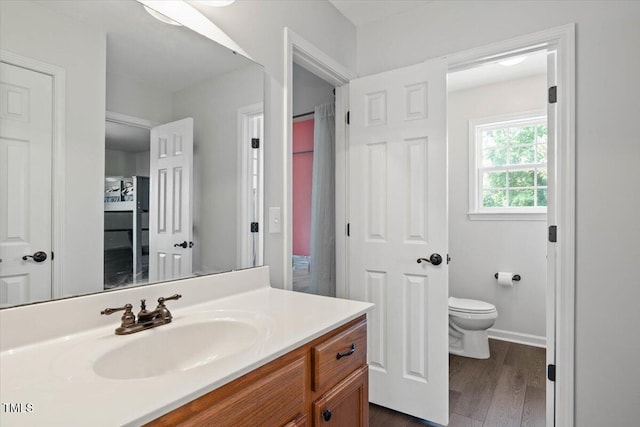 947 Middle Ground Ave, Rolesville, NC 27571 - bathroom with vanity, toilet, and wood finished floors