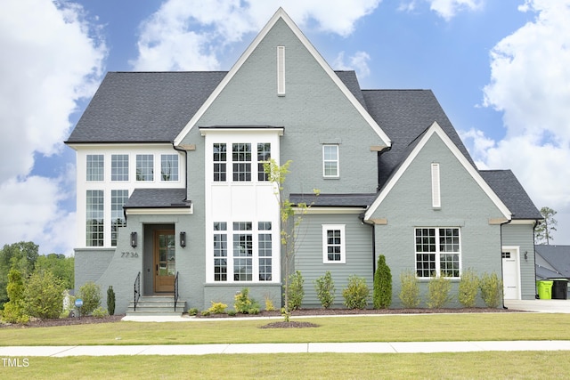 7736 Roberts Rd, Apex, NC 27523 - view of front facade with a front lawn, a shingled roof, and entry steps