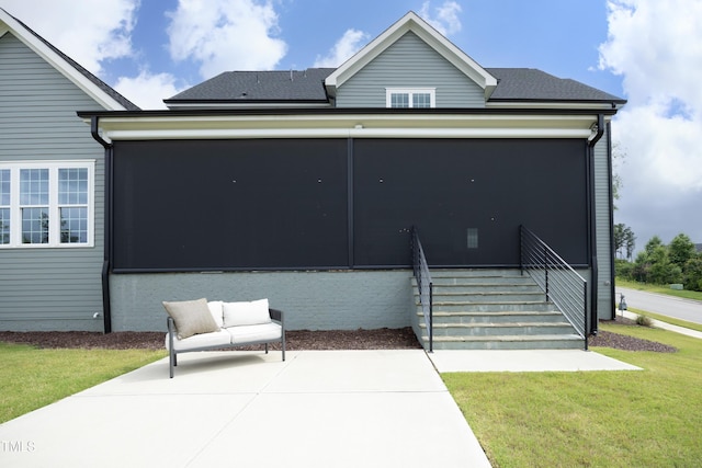 7736 Roberts Rd, Apex, NC 27523 - rear view of house featuring a sunroom, a patio, and a lawn