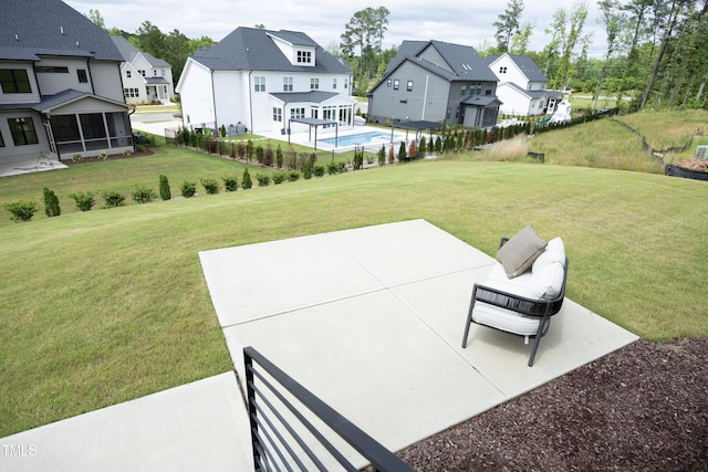 7736 Roberts Rd, Apex, NC 27523 - view of green lawn featuring a residential view, a patio, and a sunroom