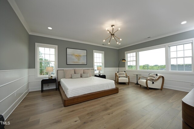 7736 Roberts Rd, Apex, NC 27523 - bedroom with ornamental molding, a chandelier, a wainscoted wall, wood finished floors, and recessed lighting