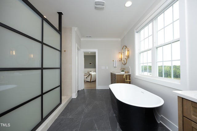 7736 Roberts Rd, Apex, NC 27523 - bathroom featuring vanity, a soaking tub, marble tiled floors, baseboards, and crown molding