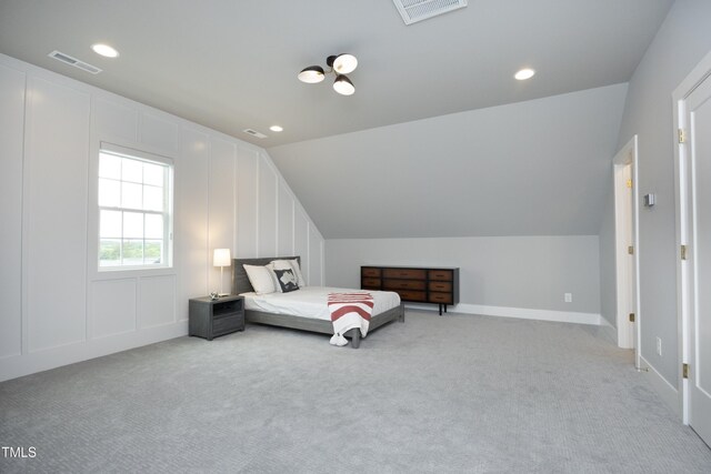 7736 Roberts Rd, Apex, NC 27523 - bedroom with a decorative wall, lofted ceiling, light colored carpet, and recessed lighting