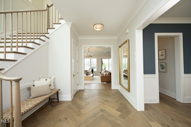 7736 Roberts Rd, Apex, NC 27523 - entrance foyer with crown molding, stairs, a chandelier, and baseboards