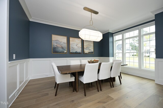 7736 Roberts Rd, Apex, NC 27523 - dining room with a wainscoted wall, ornamental molding, wood finished floors, and a decorative wall
