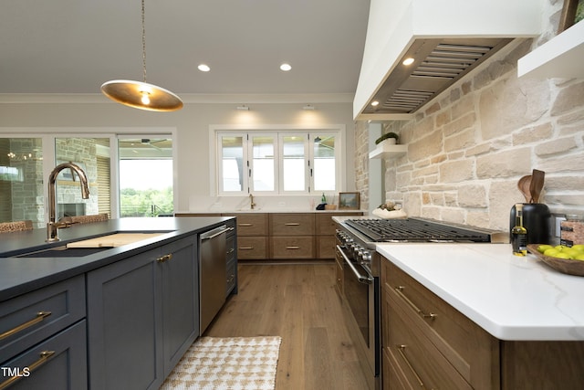 7736 Roberts Rd, Apex, NC 27523 - kitchen with stainless steel appliances, a sink, wall chimney exhaust hood, light wood-style floors, and recessed lighting