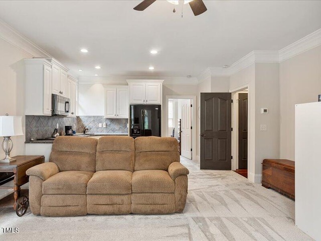 2207 Cameron Pond Dr, Cary, NC 27519 - living area featuring a ceiling fan, light carpet, crown molding, and recessed lighting