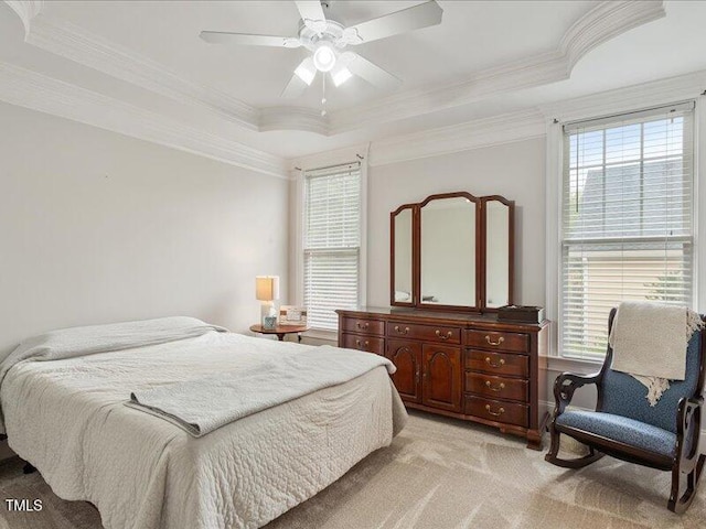 2207 Cameron Pond Dr, Cary, NC 27519 - bedroom featuring light colored carpet, ornamental molding, a raised ceiling, and a ceiling fan