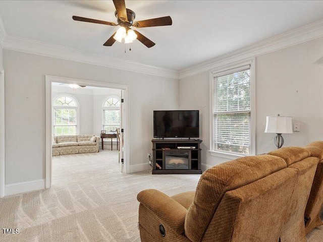 2207 Cameron Pond Dr, Cary, NC 27519 - living area with crown molding, ceiling fan, baseboards, and light colored carpet