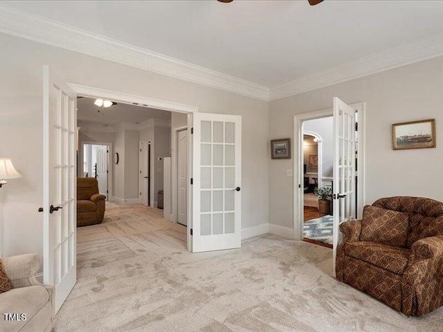 2207 Cameron Pond Dr, Cary, NC 27519 - sitting room with french doors, crown molding, carpet floors, baseboards, and a ceiling fan