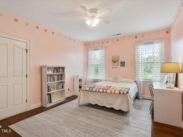 2207 Cameron Pond Dr, Cary, NC 27519 - bedroom featuring baseboards, wood finished floors, and ceiling fan