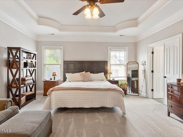 2207 Cameron Pond Dr, Cary, NC 27519 - bedroom with carpet flooring, multiple windows, a tray ceiling, ornamental molding, and baseboards