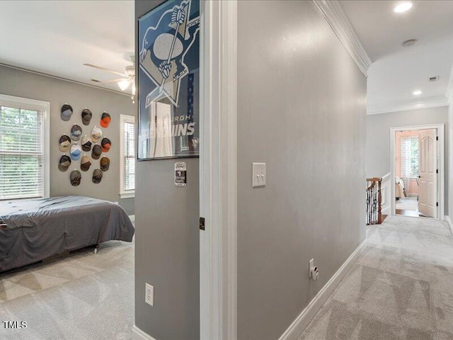 2207 Cameron Pond Dr, Cary, NC 27519 - hallway with an upstairs landing, carpet, ornamental molding, baseboards, and recessed lighting