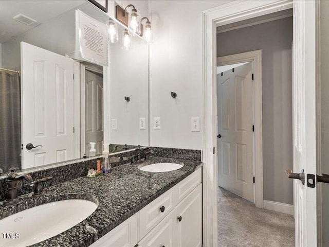 2207 Cameron Pond Dr, Cary, NC 27519 - full bath with double vanity and baseboards