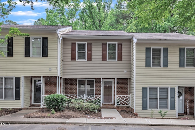 4658 Fawnbrook Cir, Raleigh, NC 27612 - view of property with brick siding and a shingled roof