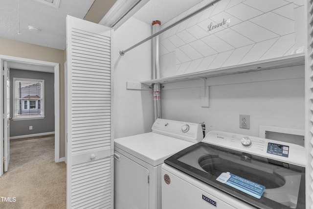 4658 Fawnbrook Cir, Raleigh, NC 27612 - laundry area with washing machine and dryer, light colored carpet, and baseboards