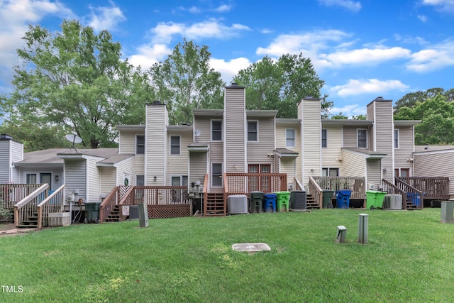 4658 Fawnbrook Cir, Raleigh, NC 27612 - rear view of house featuring a wooden deck, a lawn, stairs, and central AC