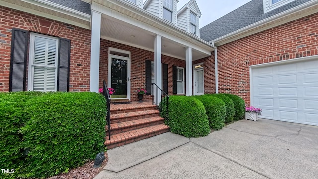 119 Georgetowne Dr, Elon, NC 27244 - view of exterior entry with brick siding, roof with shingles, and covered porch