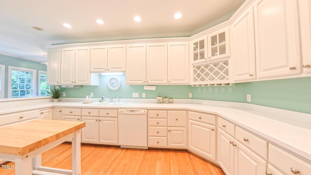 119 Georgetowne Dr, Elon, NC 27244 - kitchen with white dishwasher, a sink, light wood-style floors, light countertops, and recessed lighting