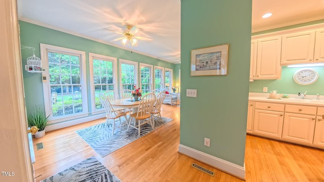 119 Georgetowne Dr, Elon, NC 27244 - dining area featuring baseboards, plenty of natural light, ornamental molding, light wood-type flooring, and ceiling fan