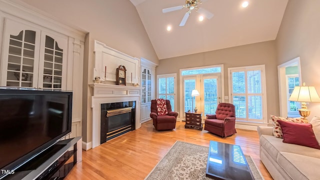119 Georgetowne Dr, Elon, NC 27244 - living room with a high end fireplace, ceiling fan, high vaulted ceiling, wood finished floors, and recessed lighting