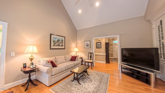 119 Georgetowne Dr, Elon, NC 27244 - living area featuring high vaulted ceiling, ceiling fan, light wood-style floors, and baseboards