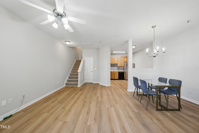 8621 Neuse Club Ln Unit 106, Raleigh, NC 27616 - dining room featuring stairs, a chandelier, light wood-type flooring, baseboards, and a ceiling fan