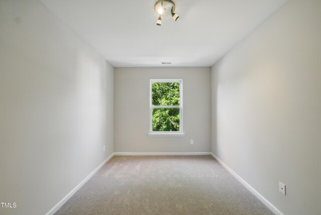 8621 Neuse Club Ln Unit 106, Raleigh, NC 27616 - carpeted empty room featuring baseboards
