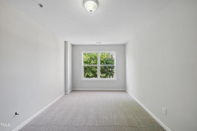 8621 Neuse Club Ln Unit 106, Raleigh, NC 27616 - spare room with carpet floors, fire sprinkler in ceiling, and baseboards