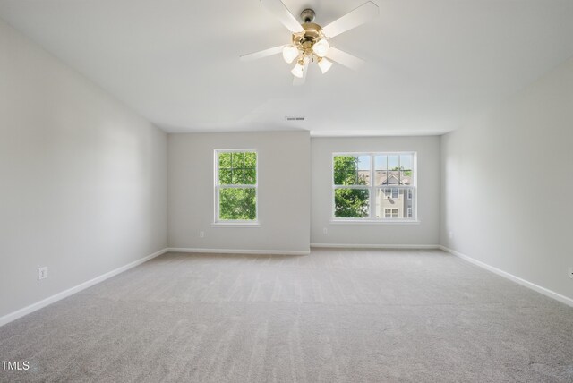 8621 Neuse Club Ln Unit 106, Raleigh, NC 27616 - carpeted empty room with plenty of natural light, baseboards, and a ceiling fan