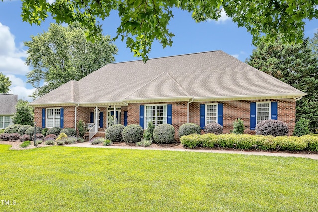 14 Marigold Pl, Durham, NC 27705 - cape cod-style house featuring a front yard and brick siding