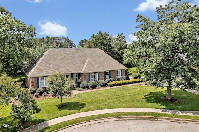 14 Marigold Pl, Durham, NC 27705 - view of front of property with brick siding, a front lawn, and roof with shingles