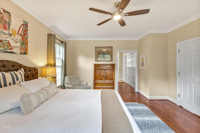 14 Marigold Pl, Durham, NC 27705 - bedroom with dark wood-style flooring, ornamental molding, baseboards, a ceiling fan, and a closet
