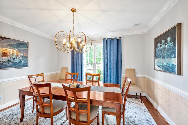 14 Marigold Pl, Durham, NC 27705 - dining space featuring a chandelier, crown molding, wood finished floors, and a wainscoted wall