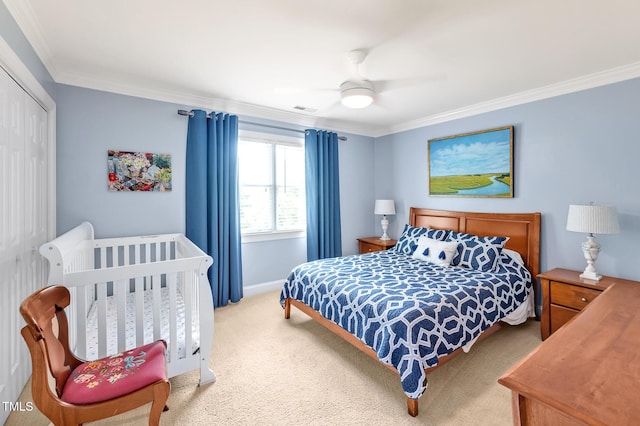14 Marigold Pl, Durham, NC 27705 - bedroom with carpet flooring, ornamental molding, a closet, ceiling fan, and baseboards