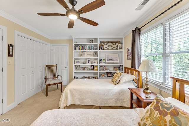 14 Marigold Pl, Durham, NC 27705 - bedroom featuring light carpet, ornamental molding, ceiling fan, and a closet