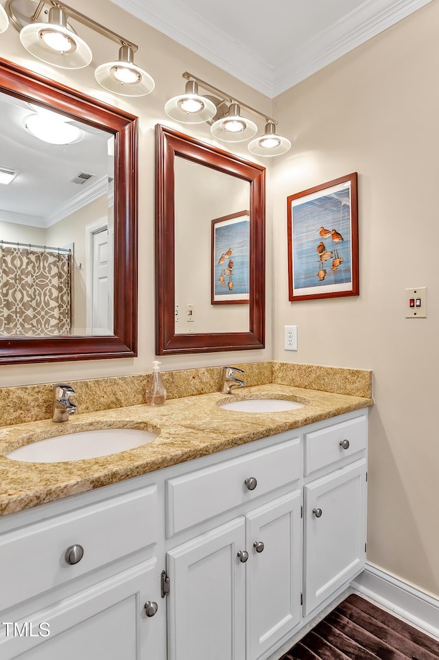 14 Marigold Pl, Durham, NC 27705 - full bath with double vanity, ornamental molding, wood finished floors, and baseboards