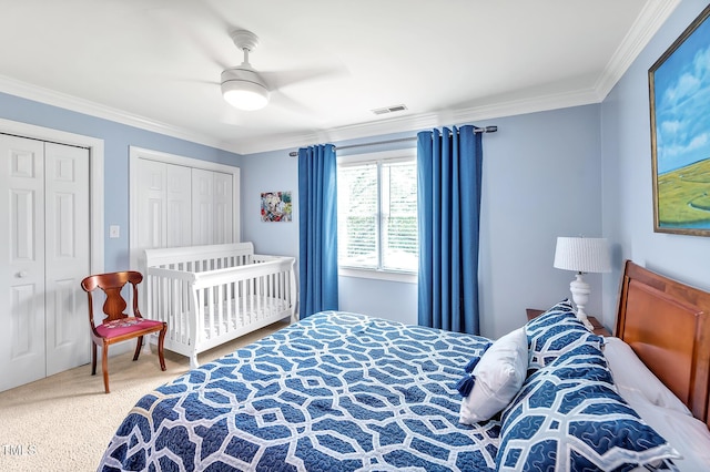 14 Marigold Pl, Durham, NC 27705 - carpeted bedroom featuring crown molding, two closets, and a ceiling fan