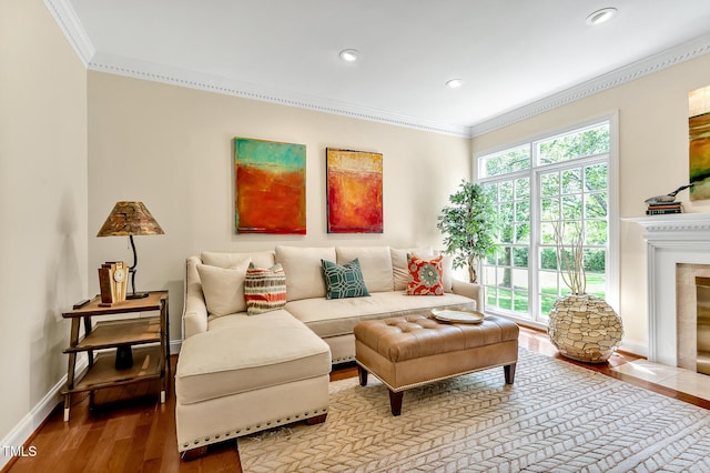 14 Marigold Pl, Durham, NC 27705 - living area with crown molding, wood finished floors, baseboards, recessed lighting, and a tile fireplace