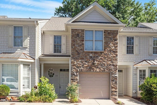 2822 Pickett Rd Unit 132, Durham, NC 27705 - view of property with stone siding, a garage, a shingled roof, and concrete driveway